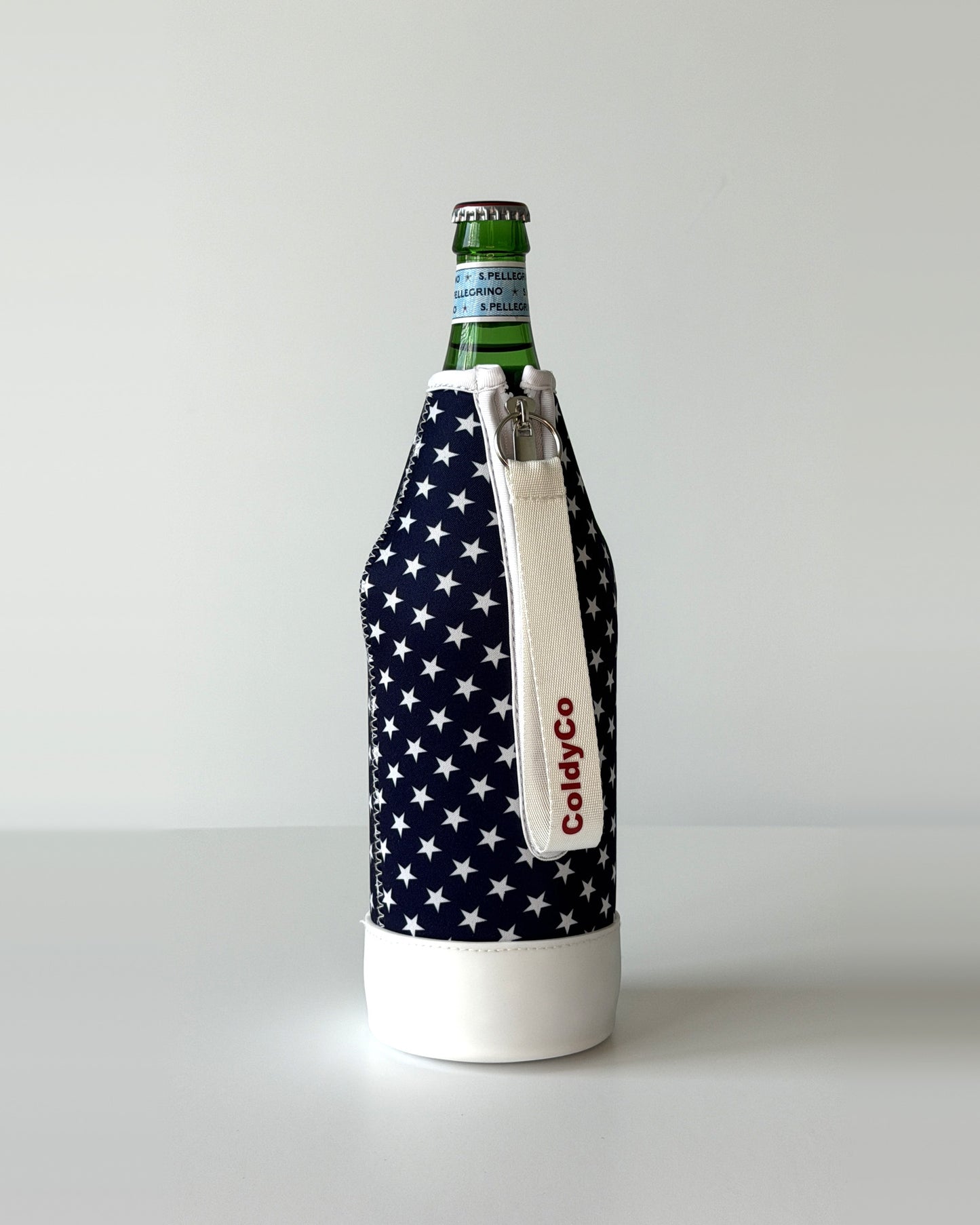 ColdyCo American Flag bottle carrier holding a swing-top glass bottle, side view