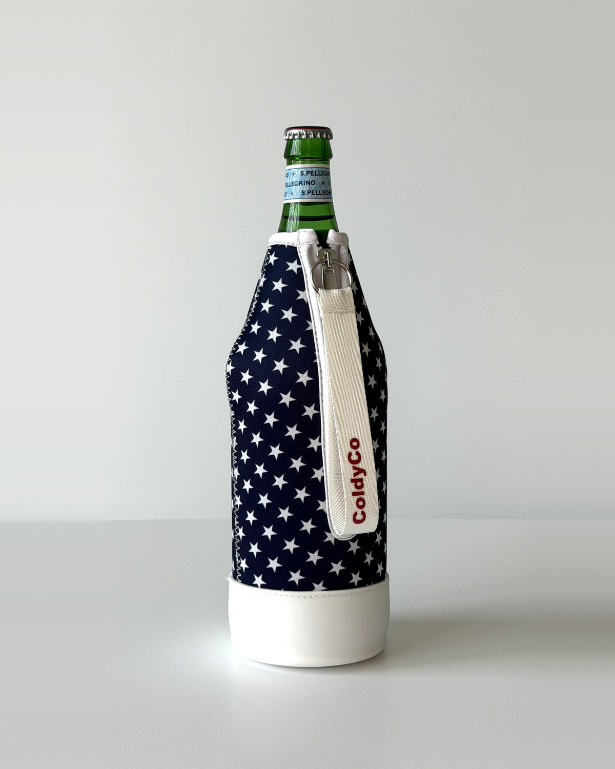 ColdyCo American Flag bottle carrier holding a swing-top glass bottle, side view