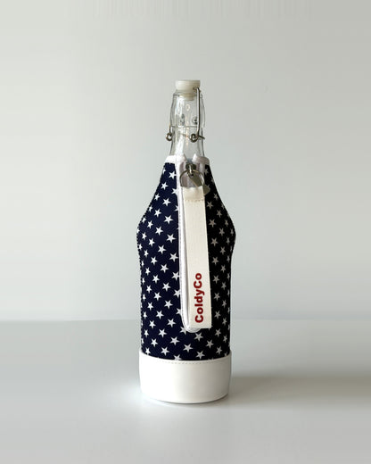 ColdyCo American Flag neoprene sleeve with wrist strap on a 1-liter glass bottle