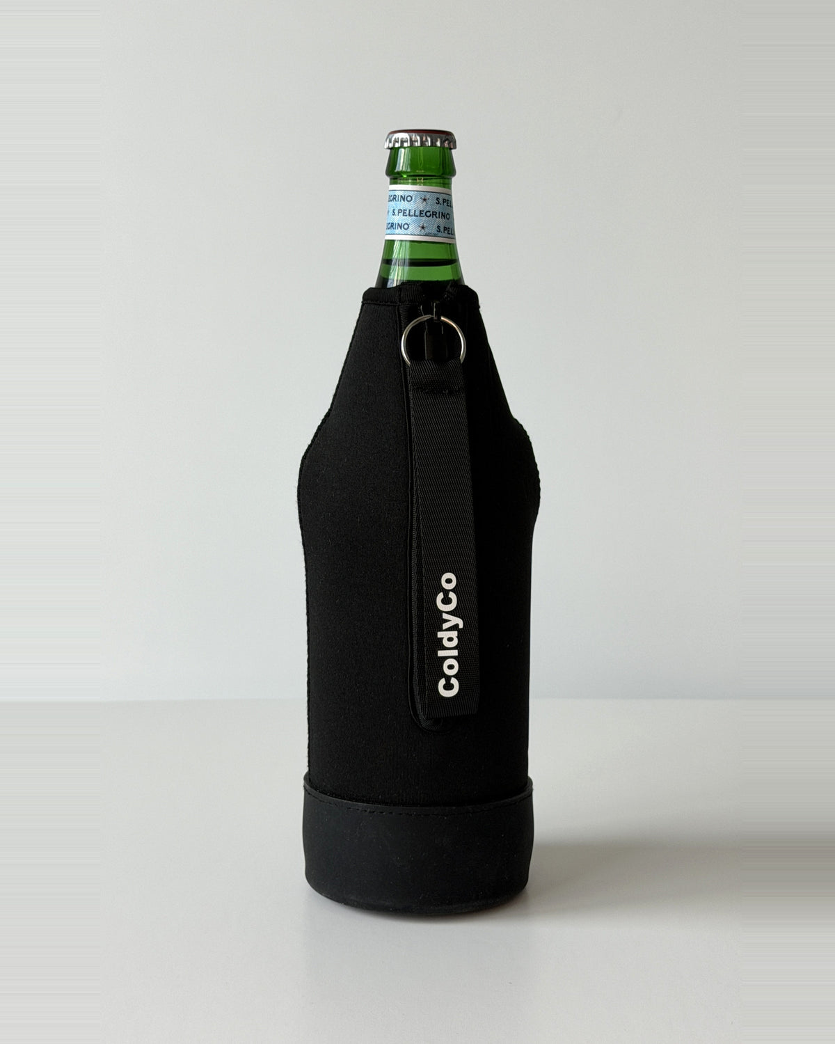 ColdyCo Black neoprene sleeve with wrist strap on a 1-liter glass bottle