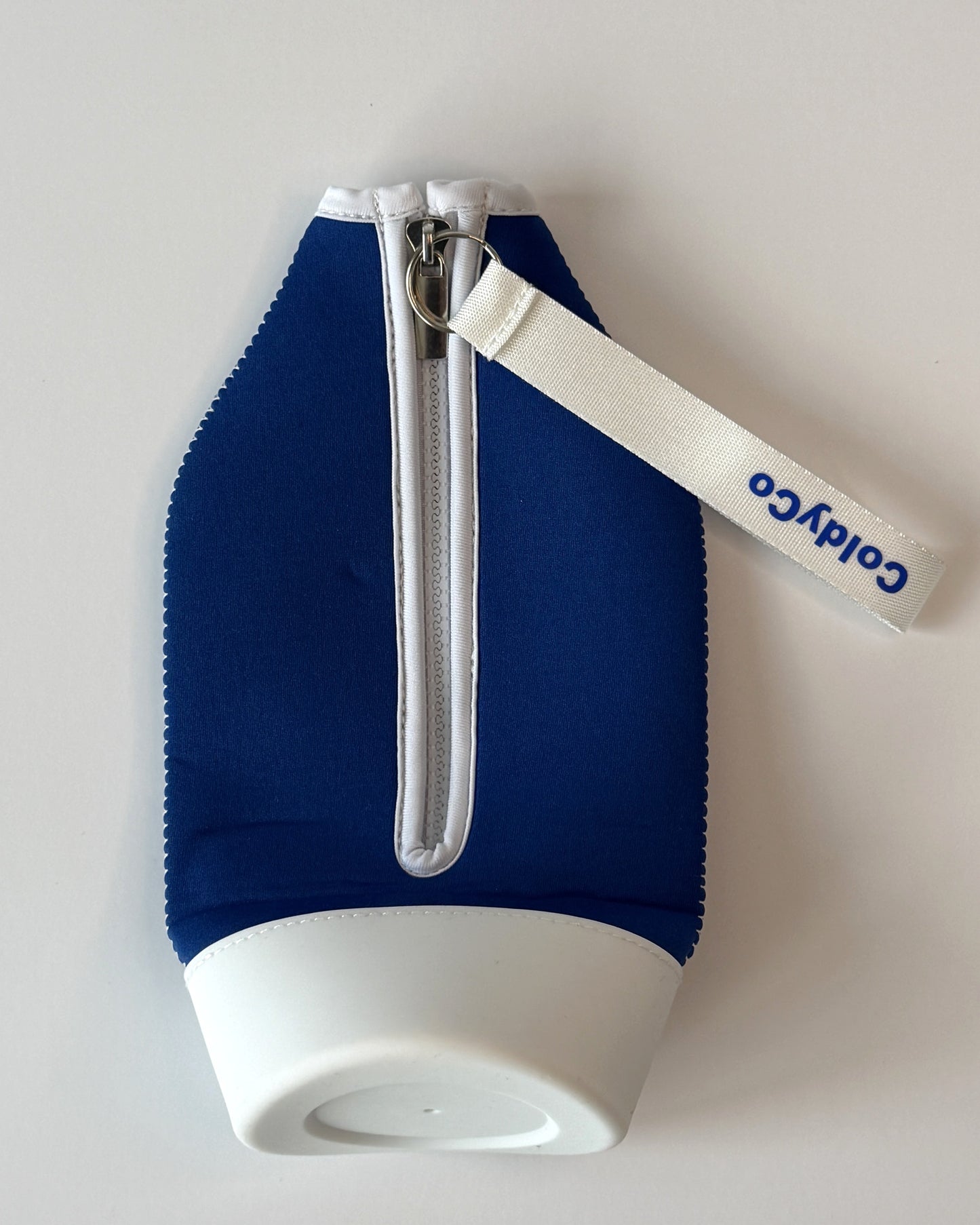 ColdyCo Blue and White carrier laid flat, showing the full-length zip and white base