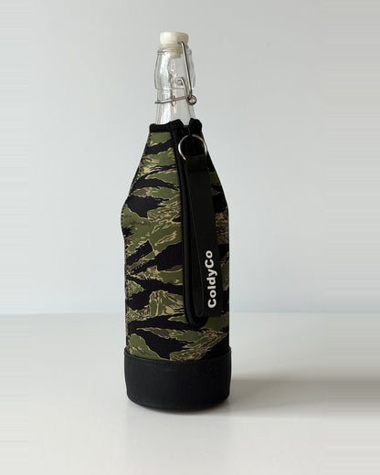 ColdyCo Camo bottle carrier holding a swing-top glass bottle, side view