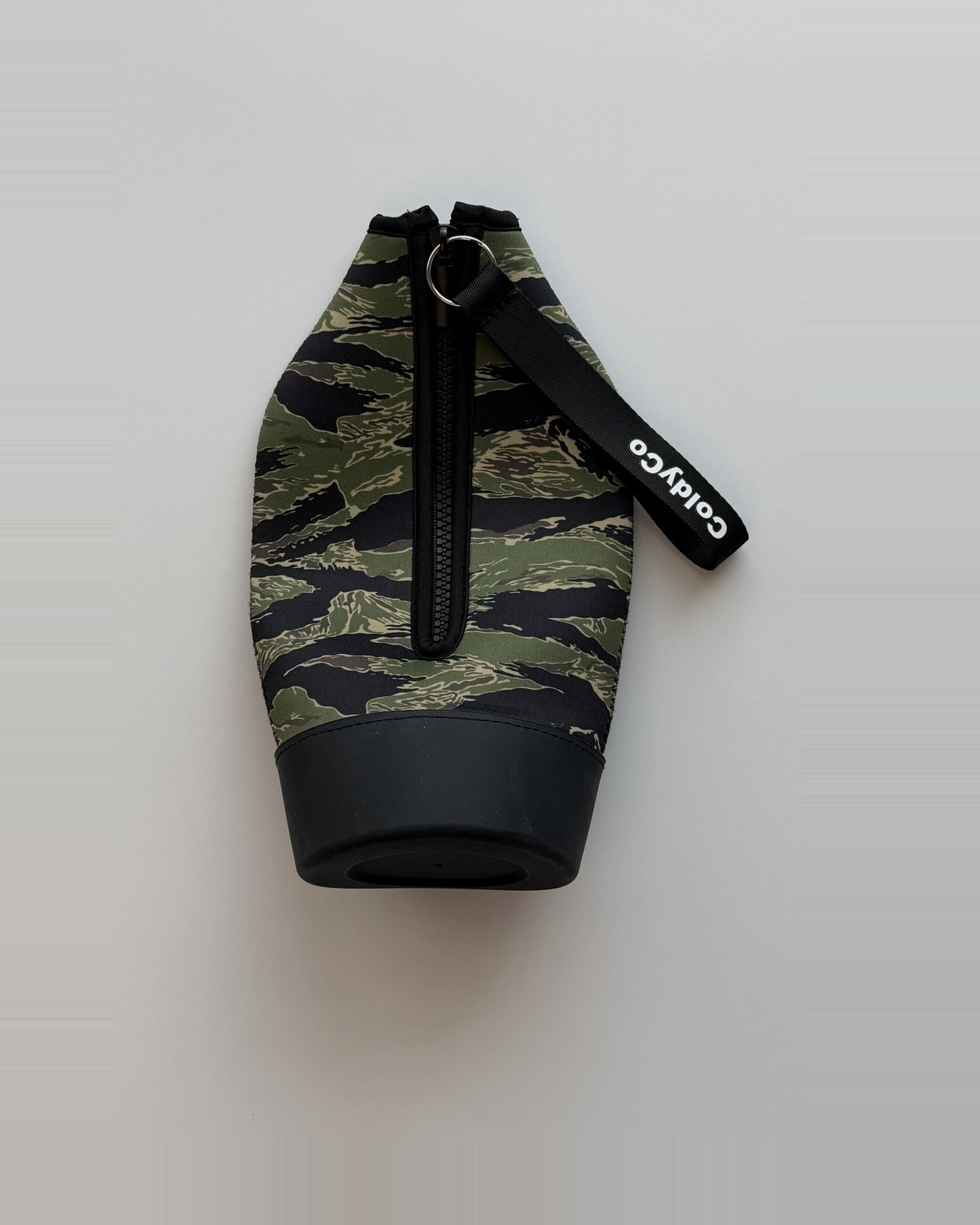 ColdyCo Camo carrier laid flat, showing the full-length zip and rubber base