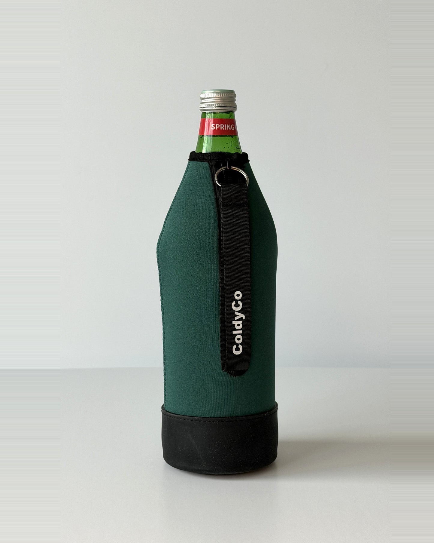 ColdyCo water bottle carrier in Forest Green on a 1-liter glass bottle