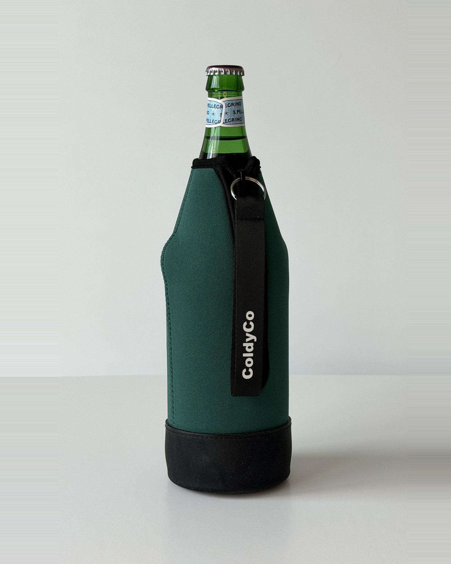 ColdyCo Forest Green neoprene sleeve with wrist strap on a 1-liter glass bottle