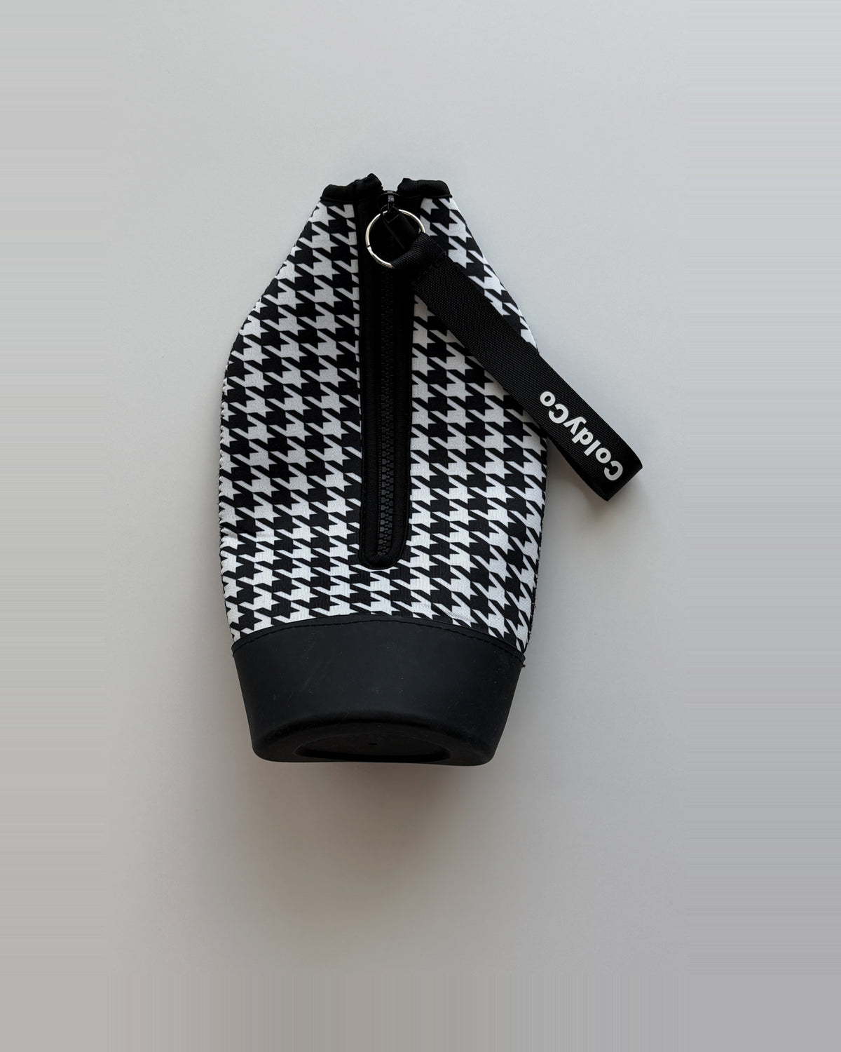 ColdyCo Houndstooth carrier laid flat, showing the full-length zip and rubber base