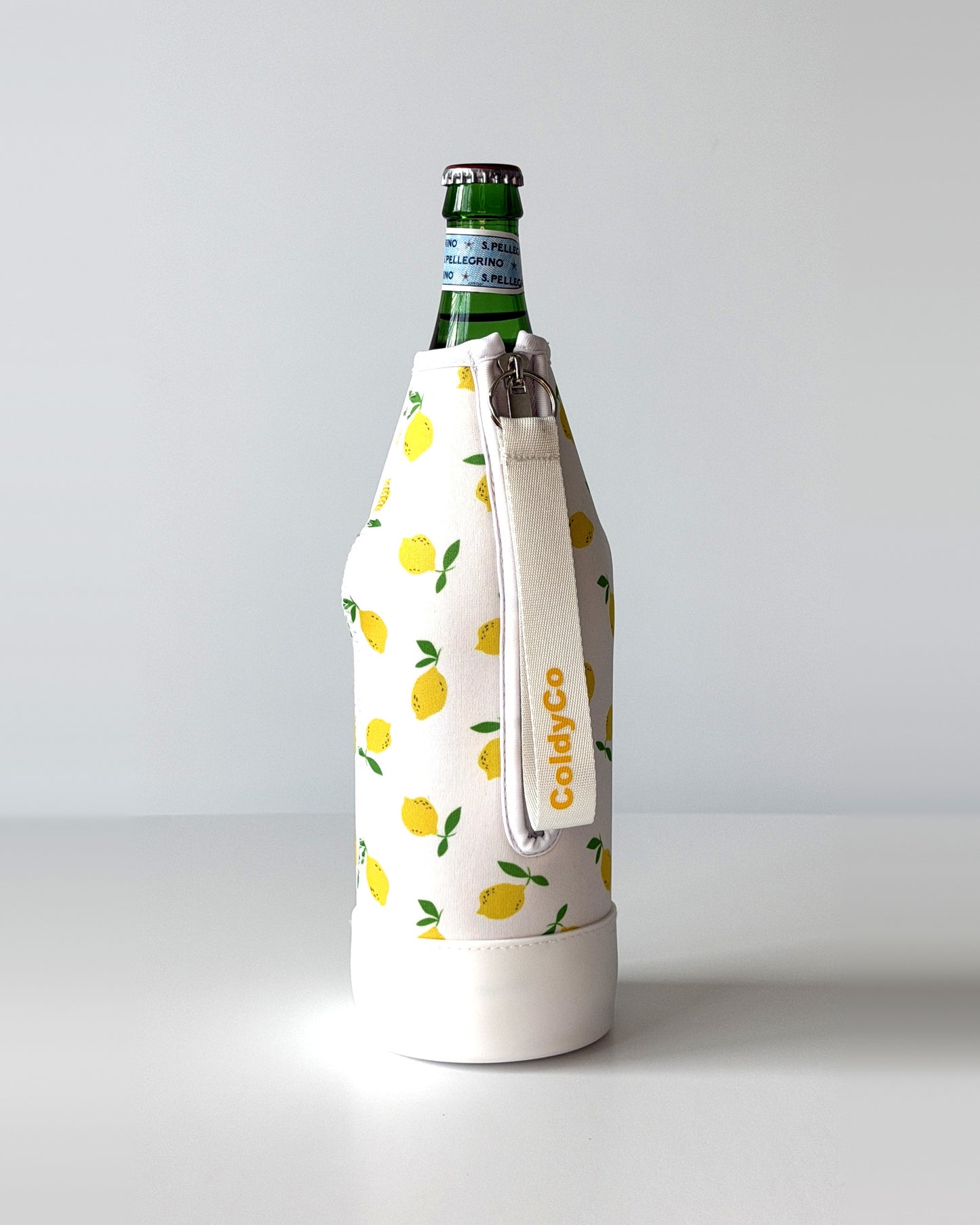 ColdyCo Lemon Print neoprene sleeve with wrist strap on a 1-liter glass bottle