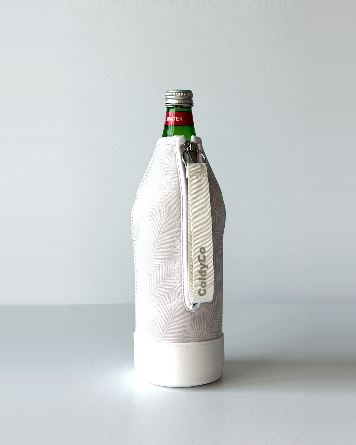 ColdyCo water bottle carrier in Palm Print on a 1-liter glass bottle