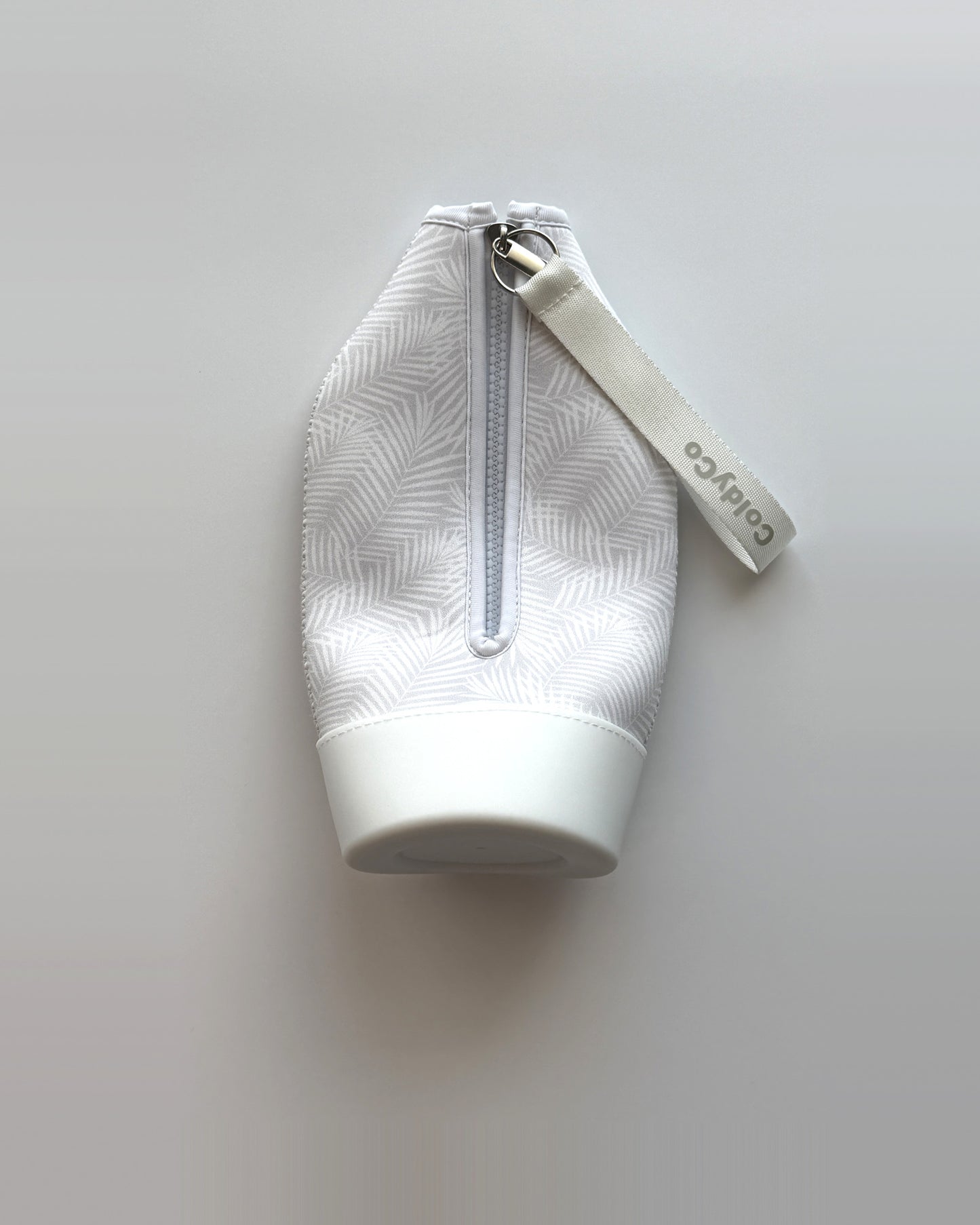 ColdyCo Palm Print carrier laid flat, showing the full-length zip and white base