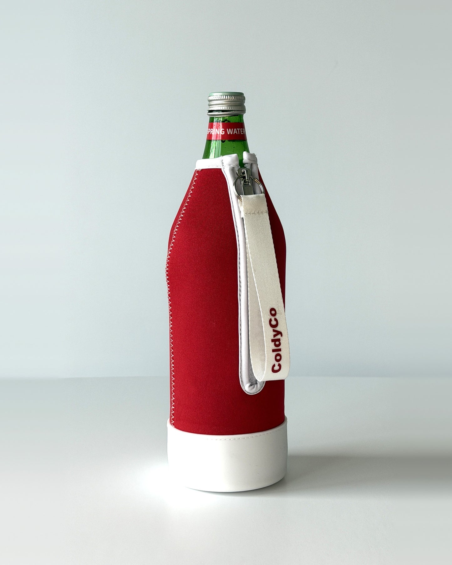 ColdyCo water bottle carrier in Red and White on a 1-liter glass bottle