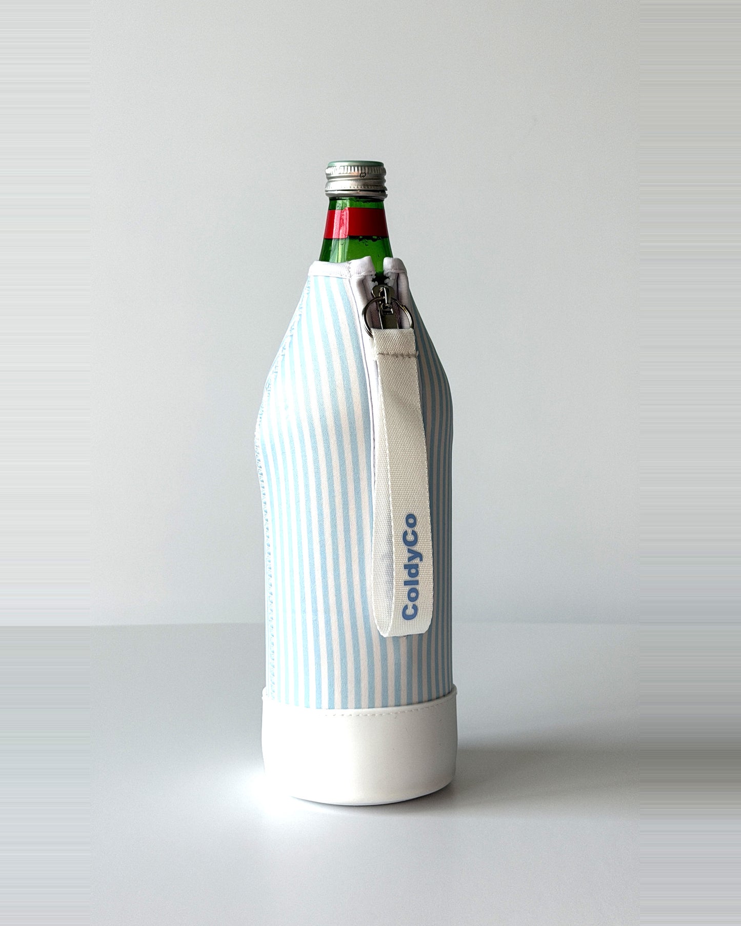 ColdyCo water bottle carrier in Sky Blue Stripe on a 1-liter glass bottle