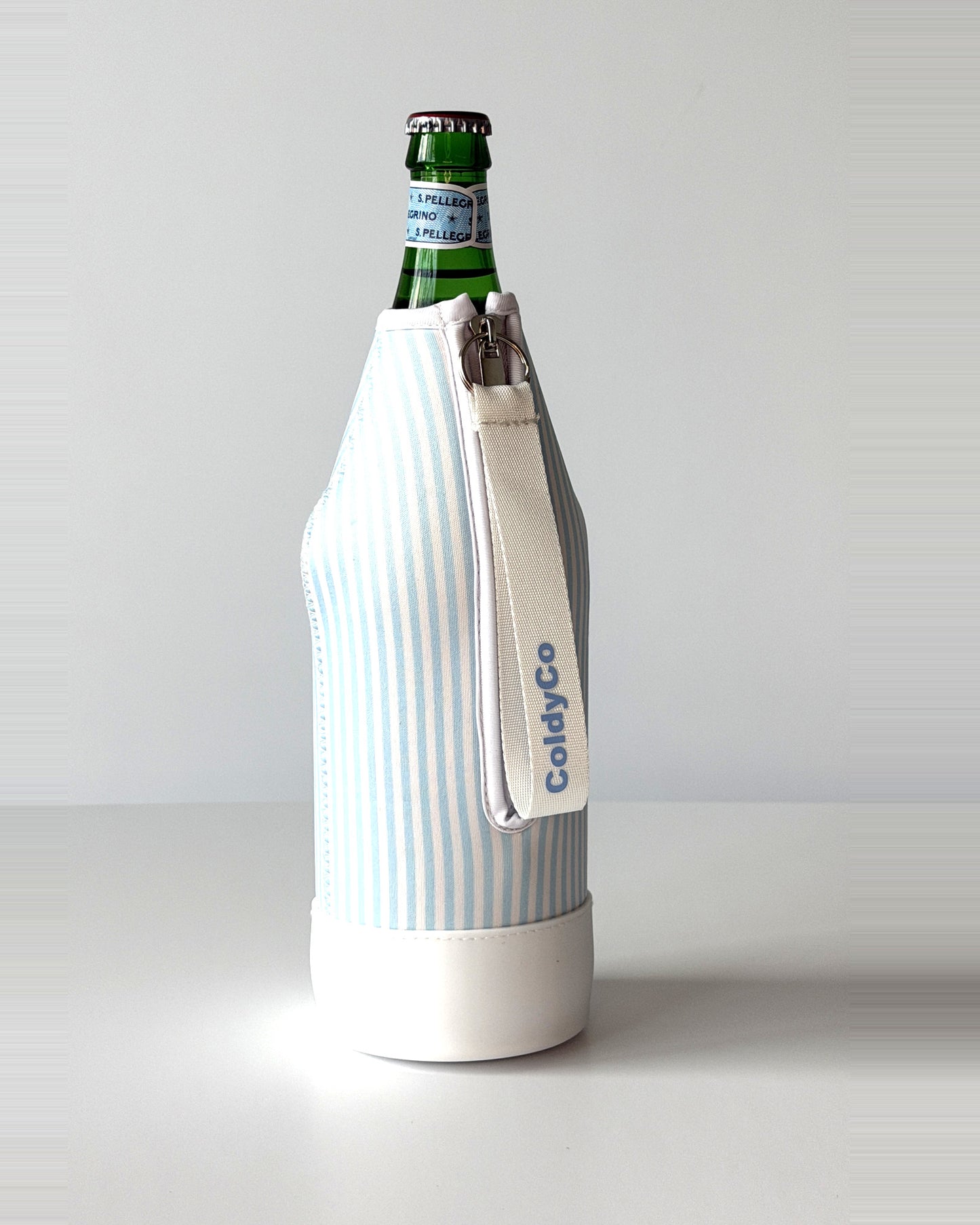 ColdyCo Sky Blue Stripe neoprene sleeve with wrist strap on a 1-liter glass bottle