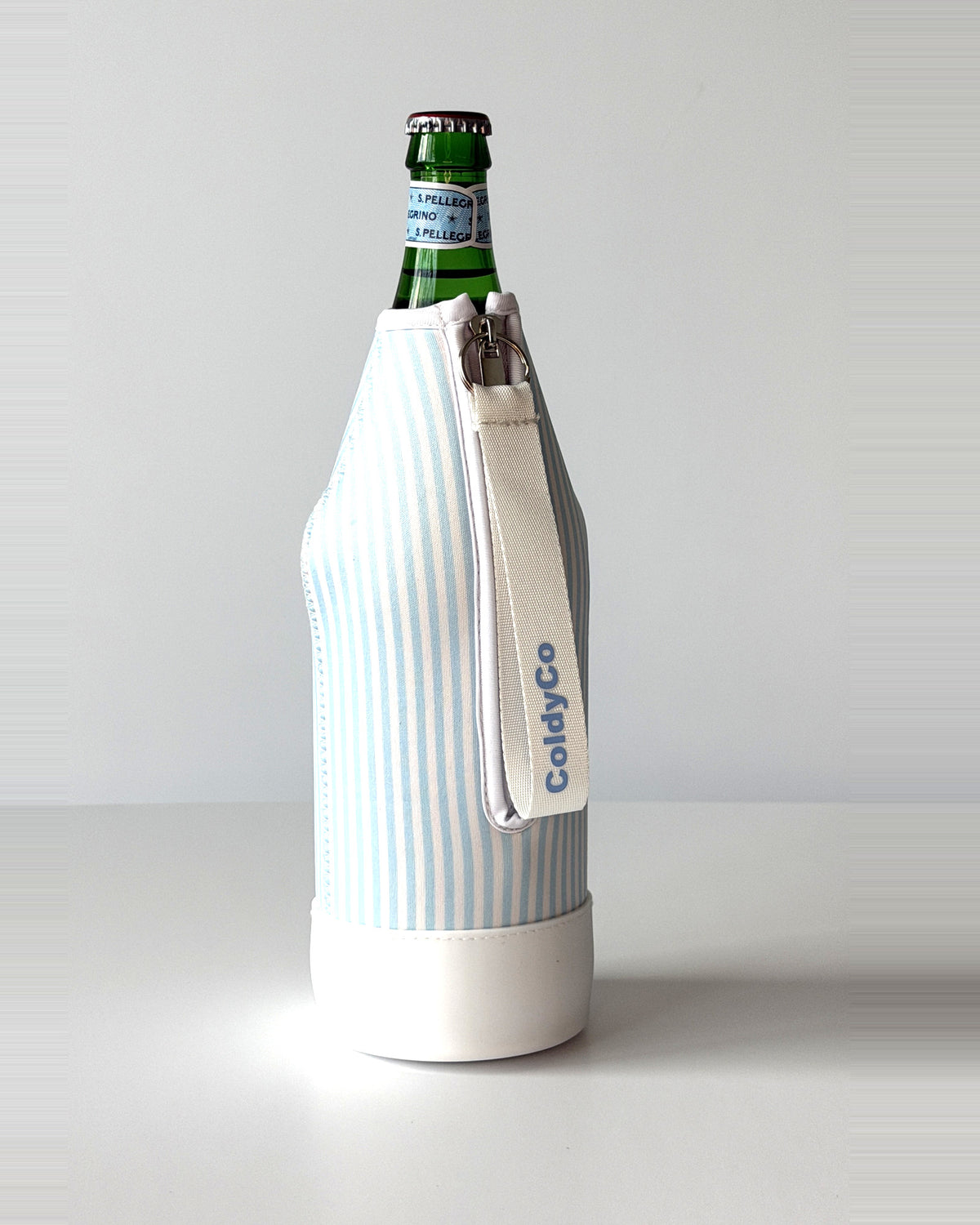 ColdyCo Sky Blue Stripe neoprene sleeve with wrist strap on a 1-liter glass bottle