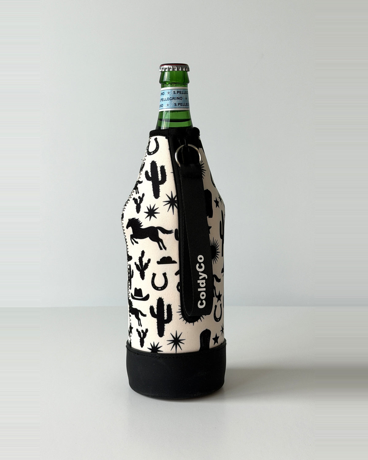 ColdyCo Western Print neoprene sleeve with wrist strap on a 1-liter glass bottle