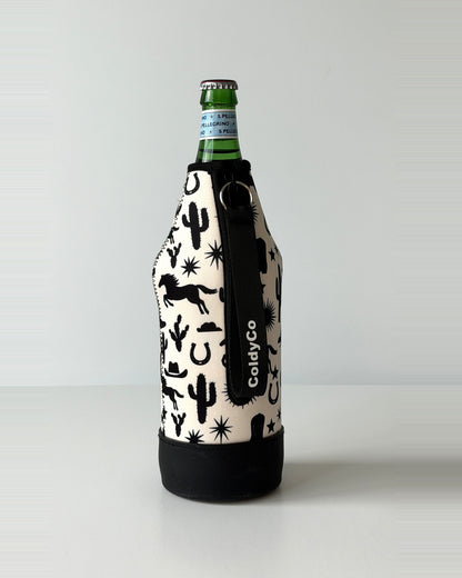 ColdyCo Western Print neoprene sleeve with wrist strap on a 1-liter glass bottle